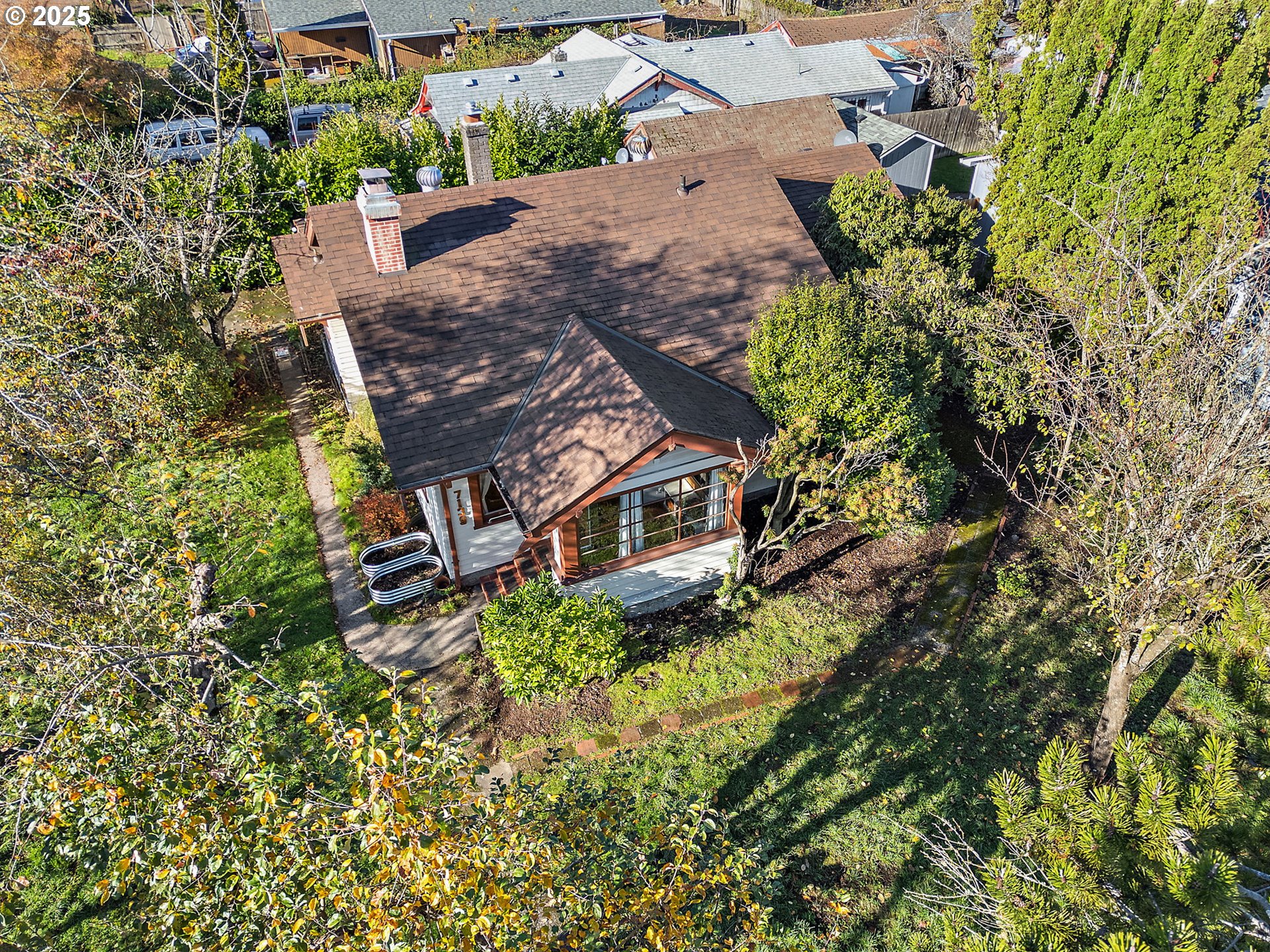 7139 Southeast 78th Avenue Portland, OR 97206 - Photo 32 of 41 a aerial view of a house with a yard plants and large trees