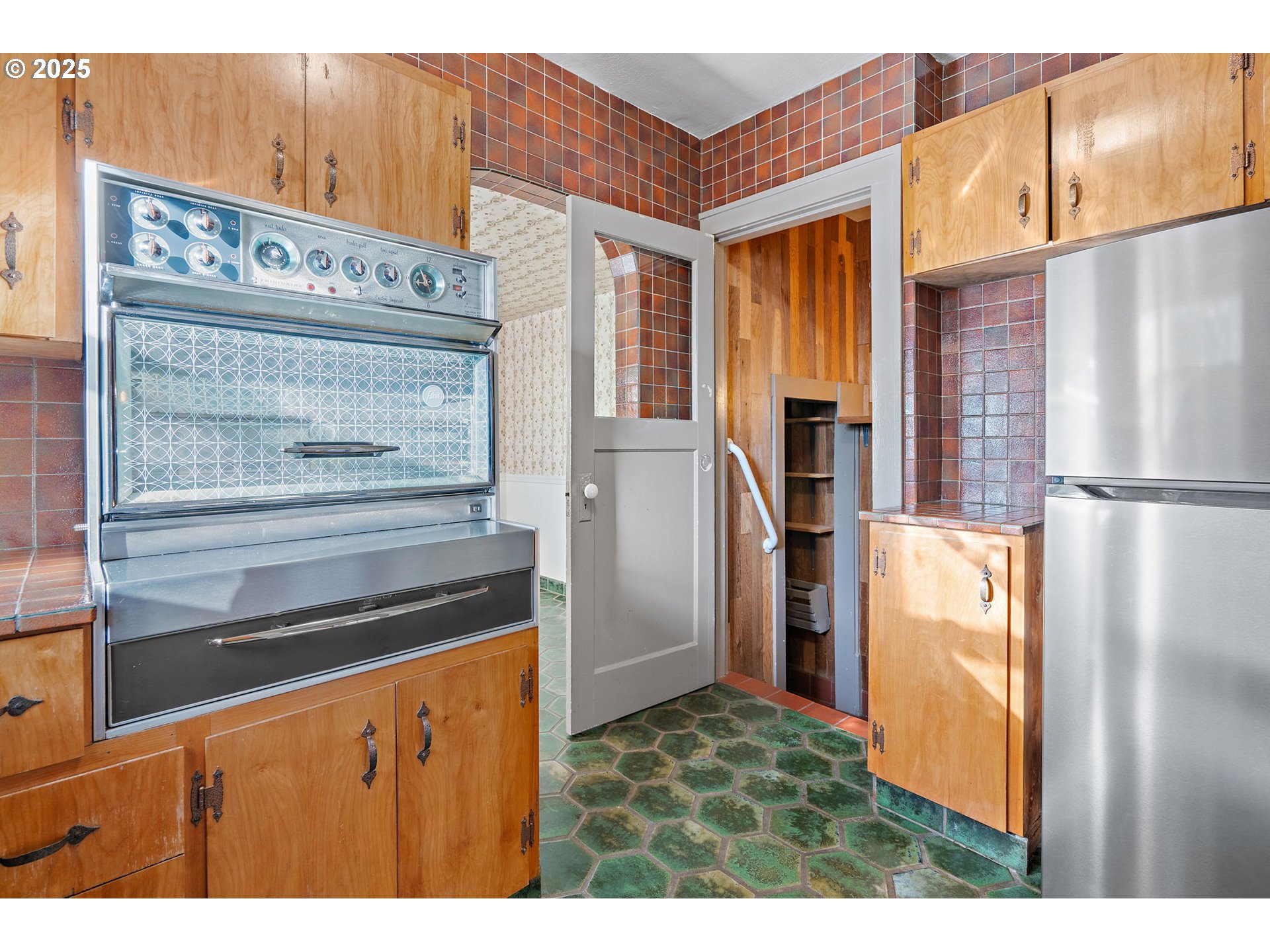 7139 Southeast 78th Avenue Portland, OR 97206 - Photo 9 of 41 a kitchen view white cabinets and stainless steel appliances