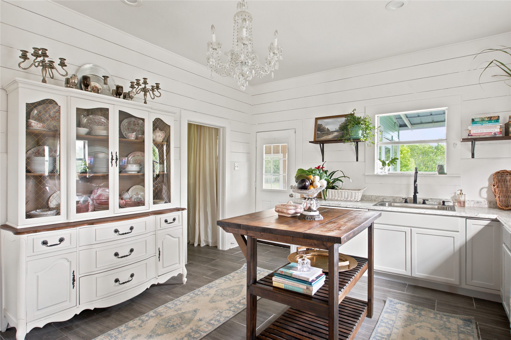 372 Old Lockhart Road Lockhart, TX 78644 - Photo 4 of 40 A charming kitchen featuring shiplap walls, open shelving and so much warmth.