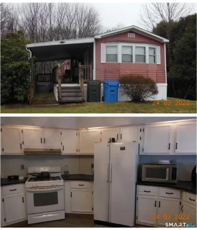 a view of kitchen with stainless steel appliances and cabinets