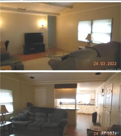 a view of a living room and entryway