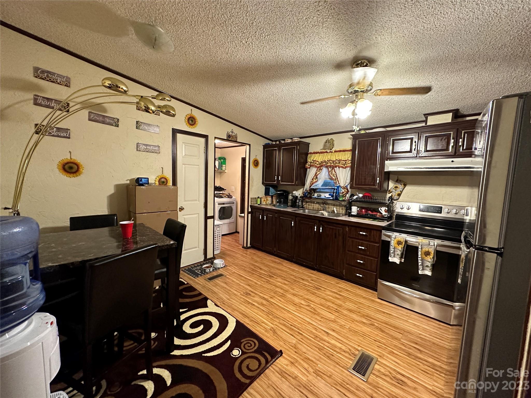 7289 Pyramid Road Hickory, NC 28602 - Photo 12 of 17 a kitchen with stainless steel appliances kitchen island granite countertop a refrigerator and a stove
