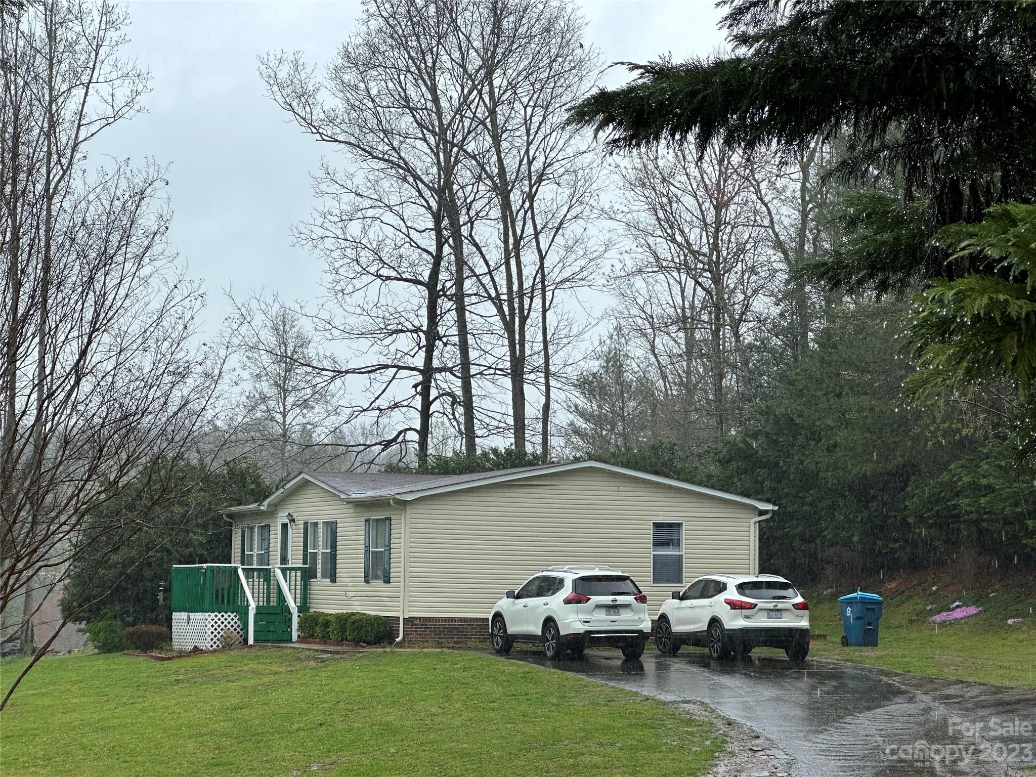 7289 Pyramid Road Hickory, NC 28602 - Photo 16 of 17 a white house that has a tree in front of it