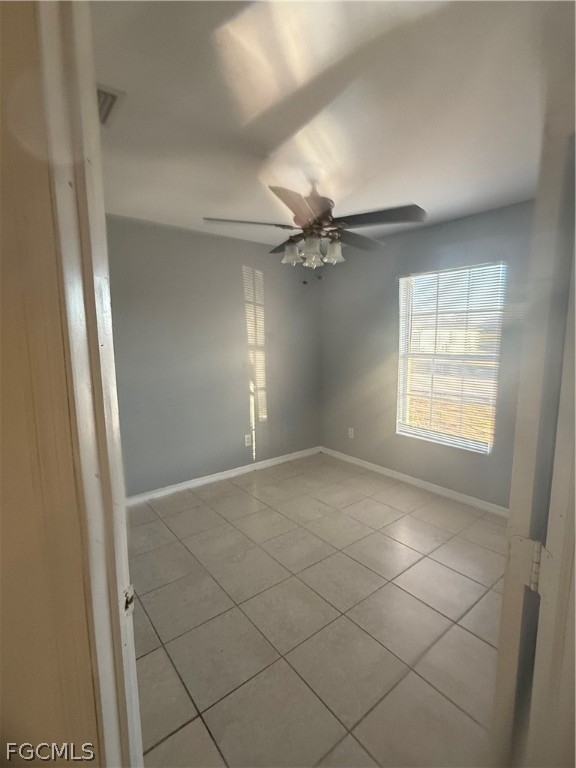 218 West 12th Street Lehigh Acres, FL 33972 - Photo 8 of 8 a view of an empty room and a window
