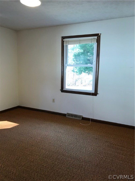 4614 Tatum Road Disputanta, VA 23842 - Photo 5 of 7 a view of a small space with window