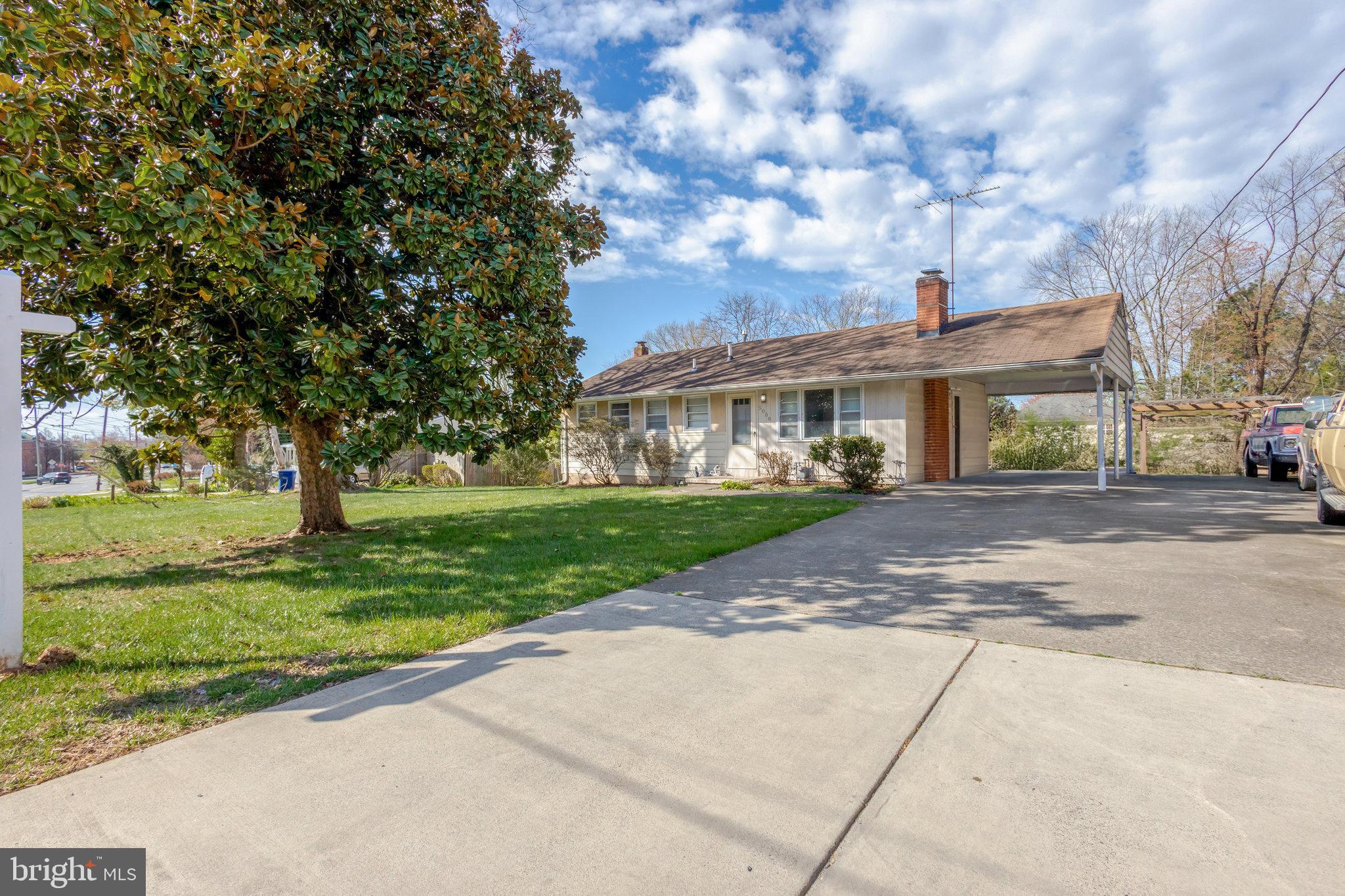5008 Backlick Road Annandale, VA 22003 - Photo 1 of 14 a front view of a house with a yard