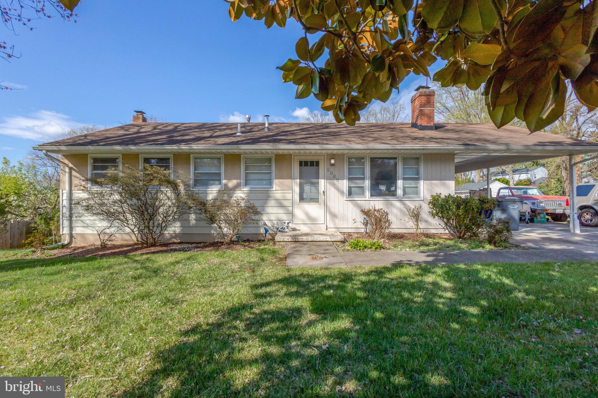 5008 Backlick Road Annandale, VA 22003 - Photo 13 of 14 a front view of a house with garden