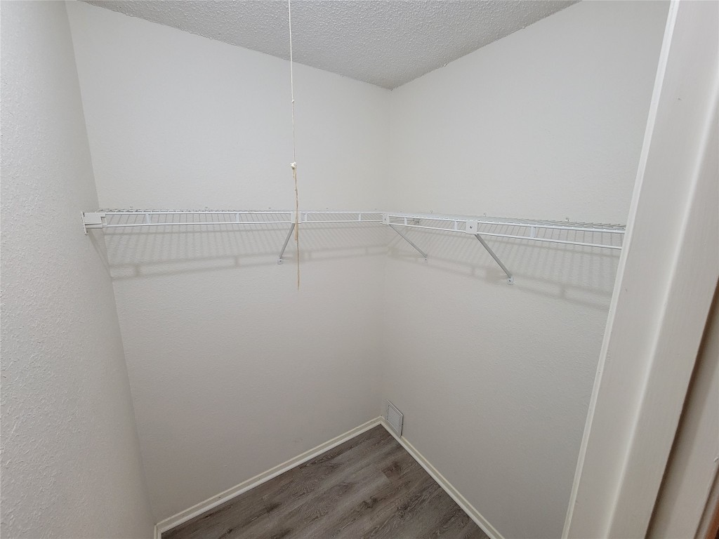 1015 East Yager Lane, Unit 69 Austin, TX 78753 - Photo 10 of 16 a view of a room with racks on the wall