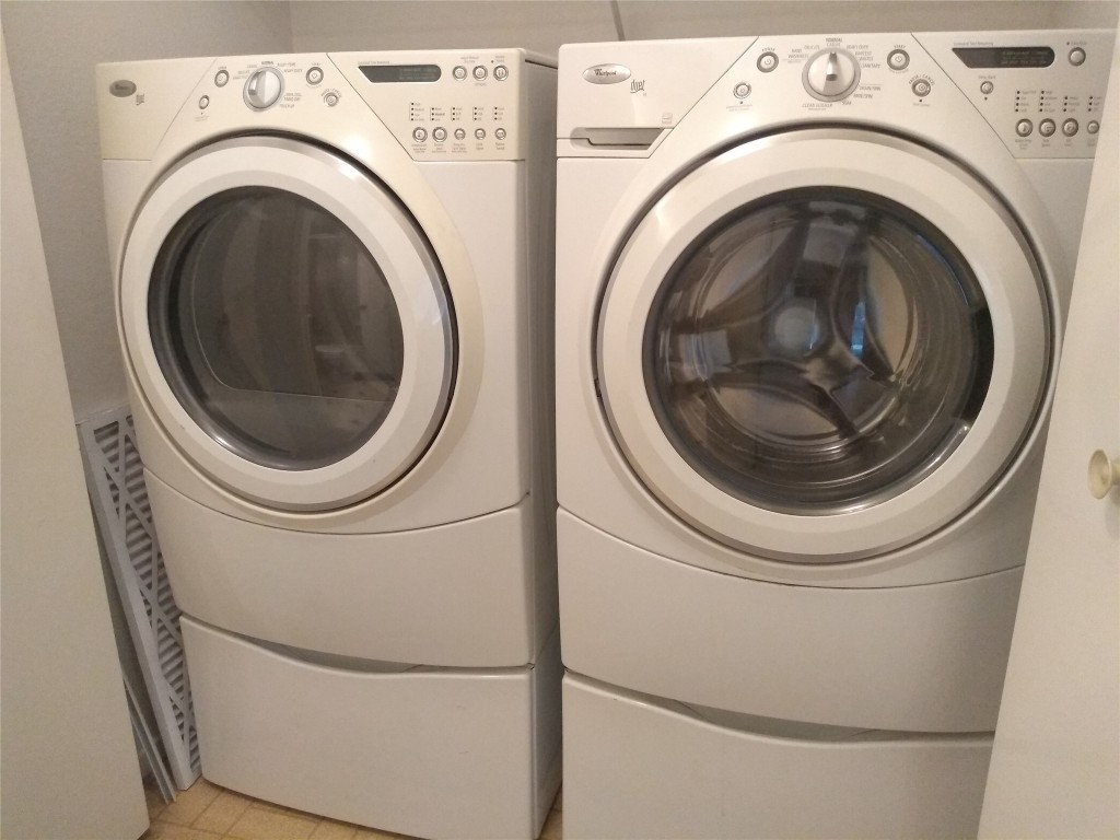 1015 East Yager Lane, Unit 69 Austin, TX 78753 - Photo 11 of 16 a utility room with dryer and washer