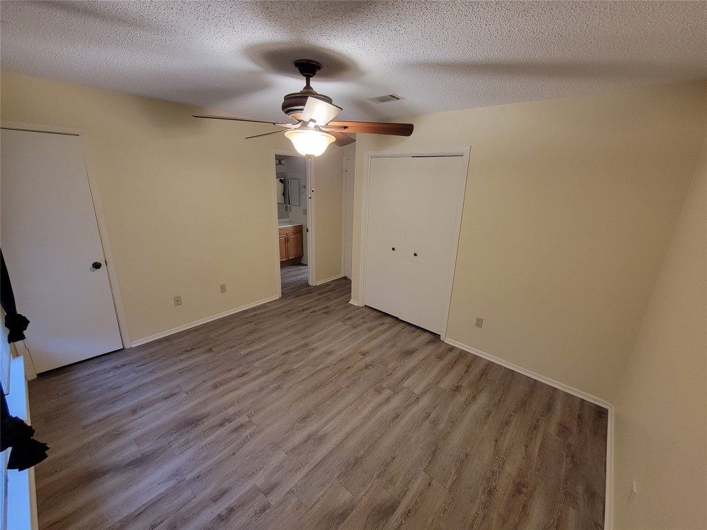 1015 East Yager Lane, Unit 69 Austin, TX 78753 - Photo 7 of 16 a view of empty room with wooden floor