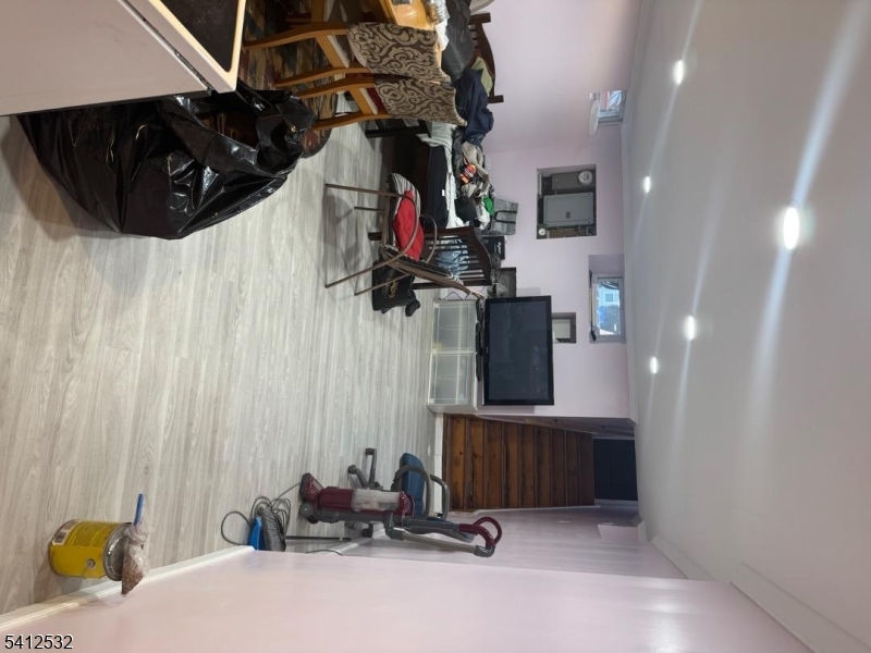 2 Harrison Street Belleville, NJ 07109 - Photo 5 of 11 a room with gym equipment and a mirror