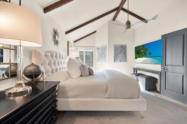 a bathroom with a white bath tub sitting next to a shower