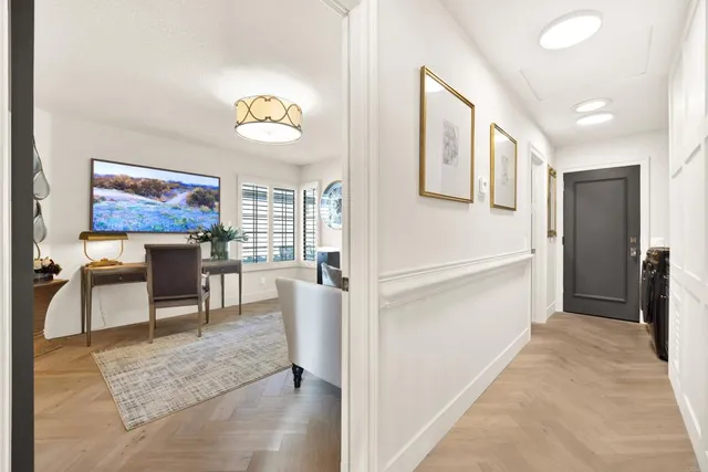 a view of a porch with a table & chairs