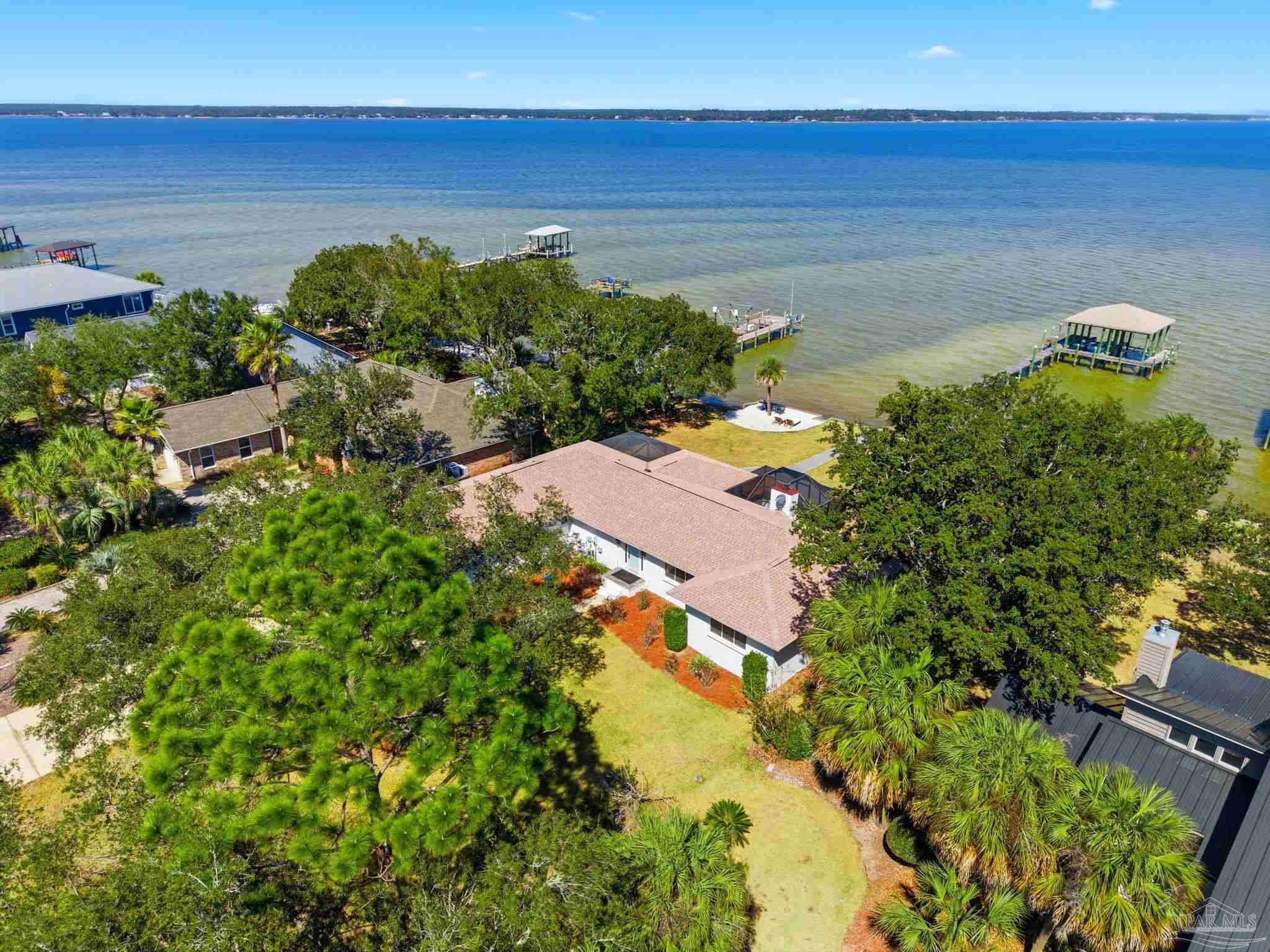 5470 North Shore Road Pensacola, FL 32507 - Photo 3 of 63 an aerial view of ocean with residential house with outdoor space