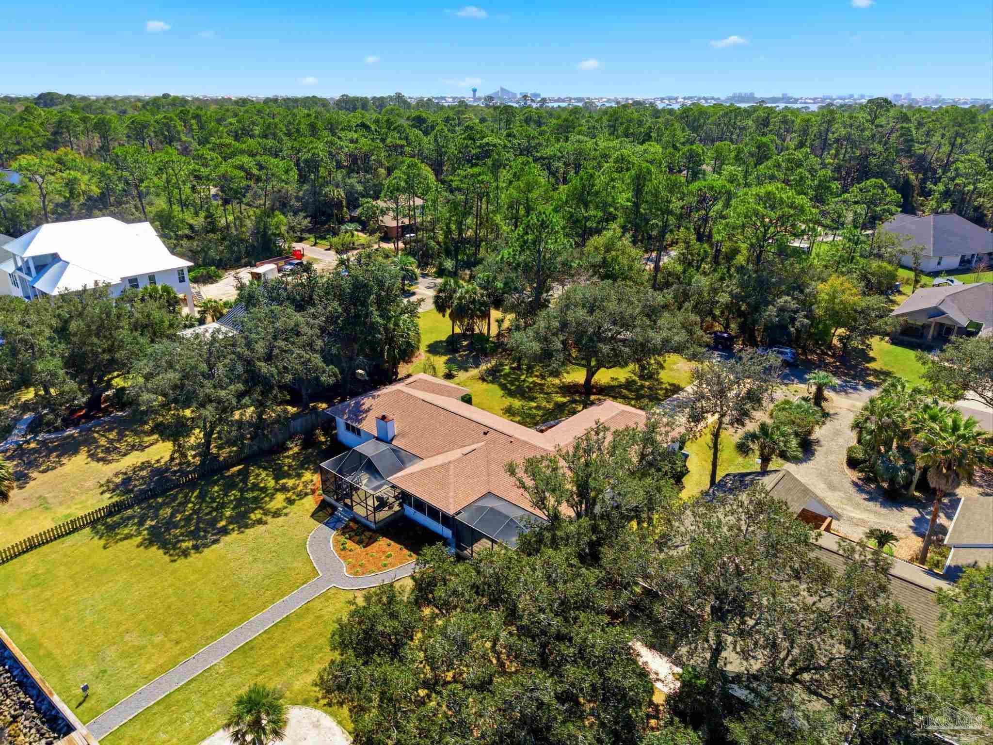 5470 North Shore Road Pensacola, FL 32507 - Photo 50 of 63 an aerial view of a house with a yard
