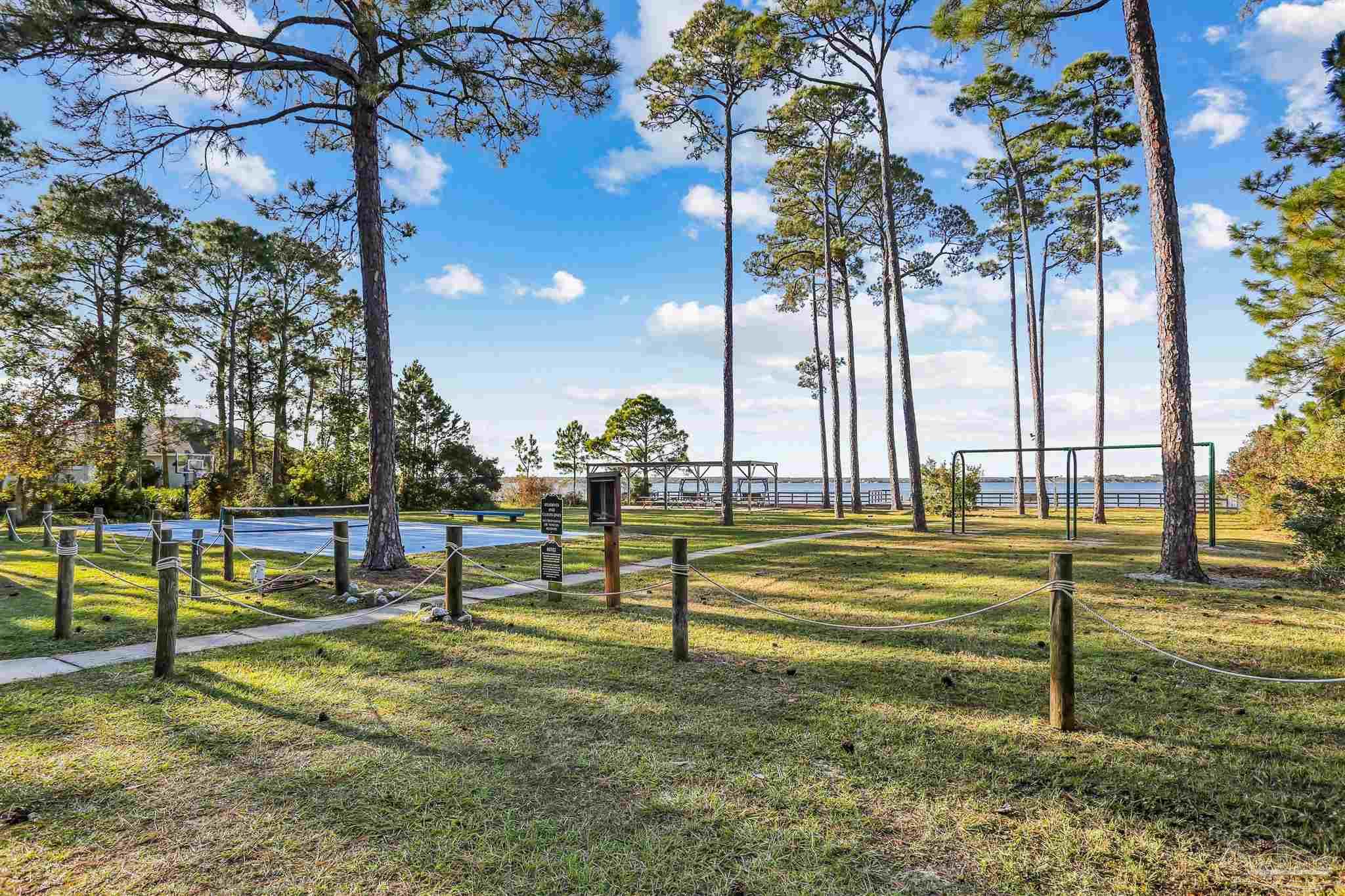 5470 North Shore Road Pensacola, FL 32507 - Photo 54 of 63 a view of a park with large trees