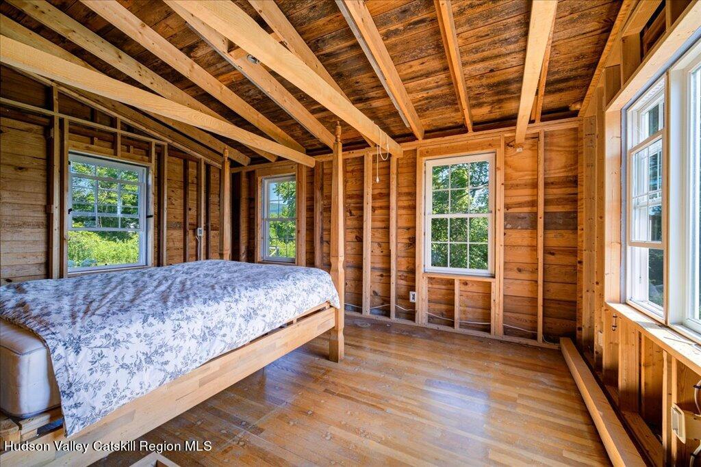 2184 Bruynswick Road Wallkill, NY 12589 - Photo 23 of 34 a bed sitting in a bedroom next to a large window