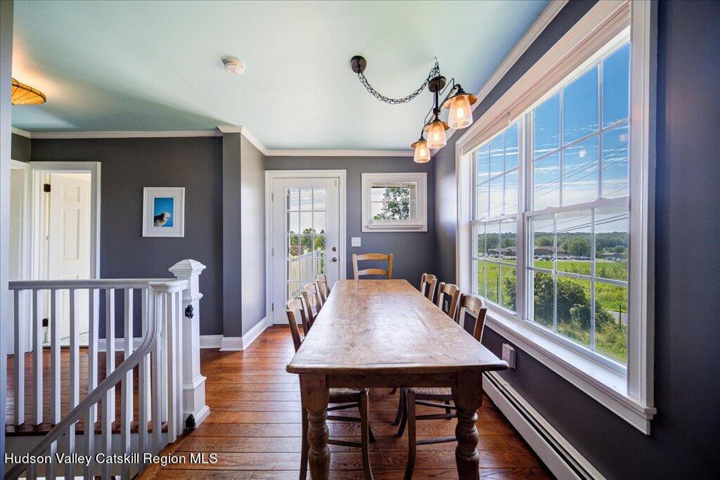 2184 Bruynswick Road Wallkill, NY 12589 - Photo 7 of 34 a view of a dining room with furniture window and wooden floor