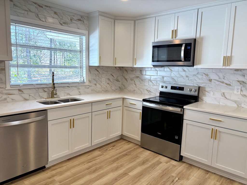 2502 13th Avenue Valley, AL 36854 - Photo 15 of 56 a kitchen with a sink stove and microwave