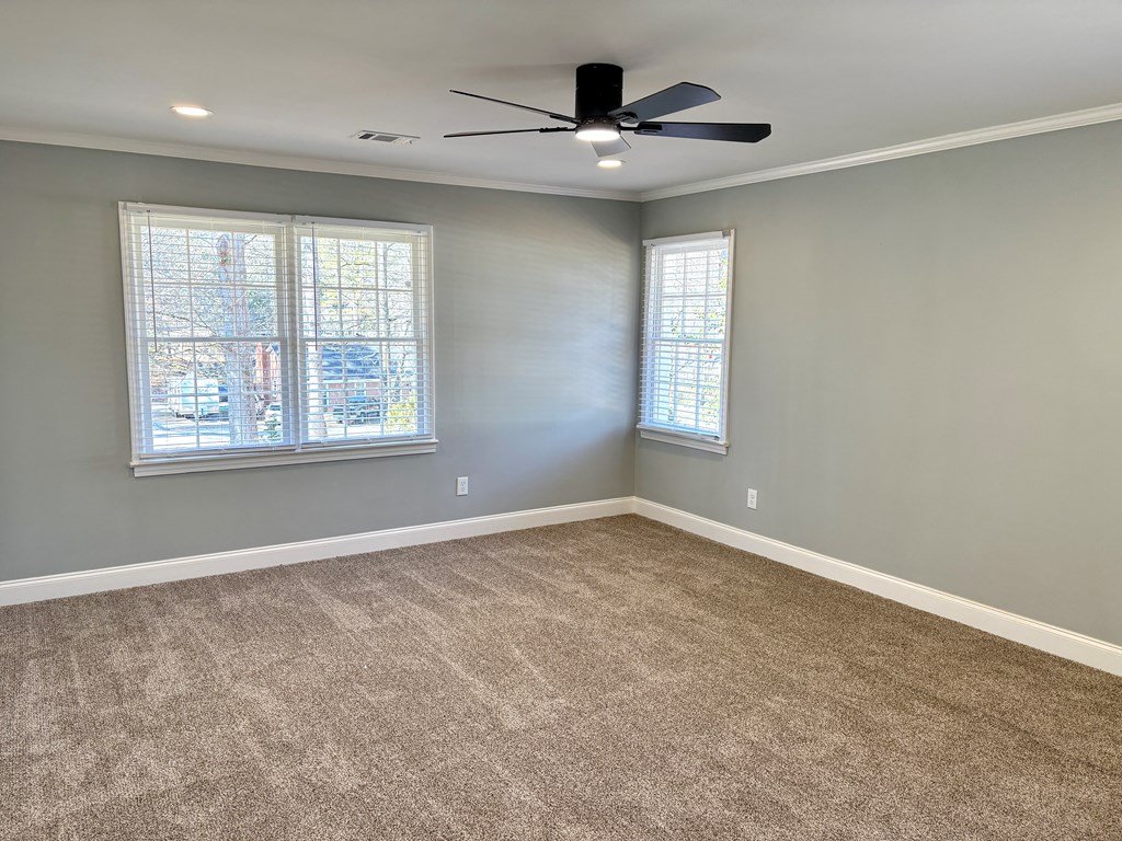 2502 13th Avenue Valley, AL 36854 - Photo 20 of 56 an empty room with windows and ceiling fan