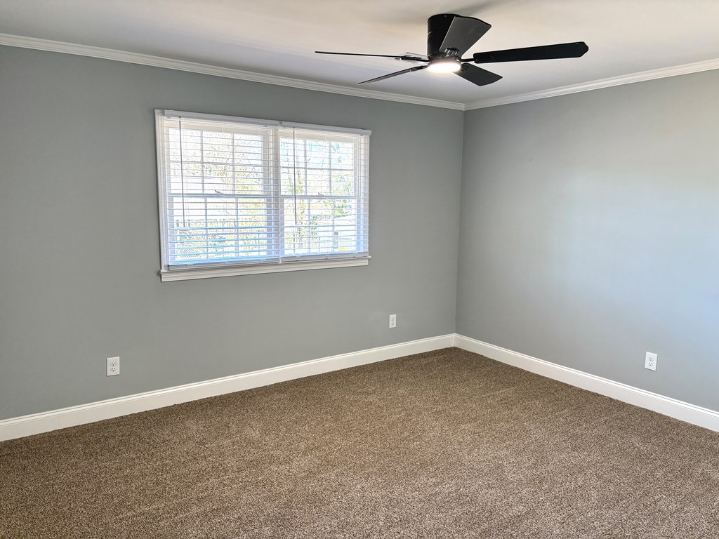 2502 13th Avenue Valley, AL 36854 - Photo 24 of 56 an empty room with a window and a ceiling fan