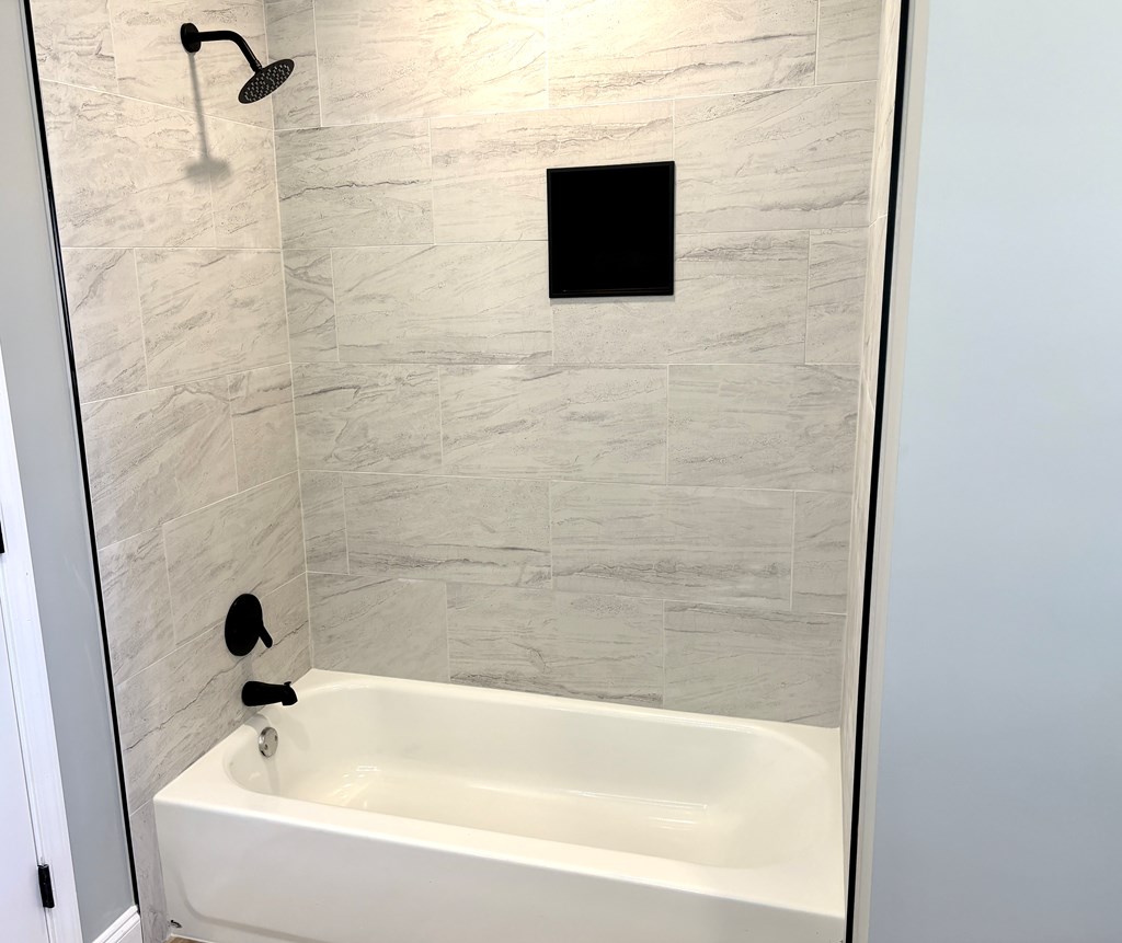 2502 13th Avenue Valley, AL 36854 - Photo 30 of 56 a bathroom with a bathtub