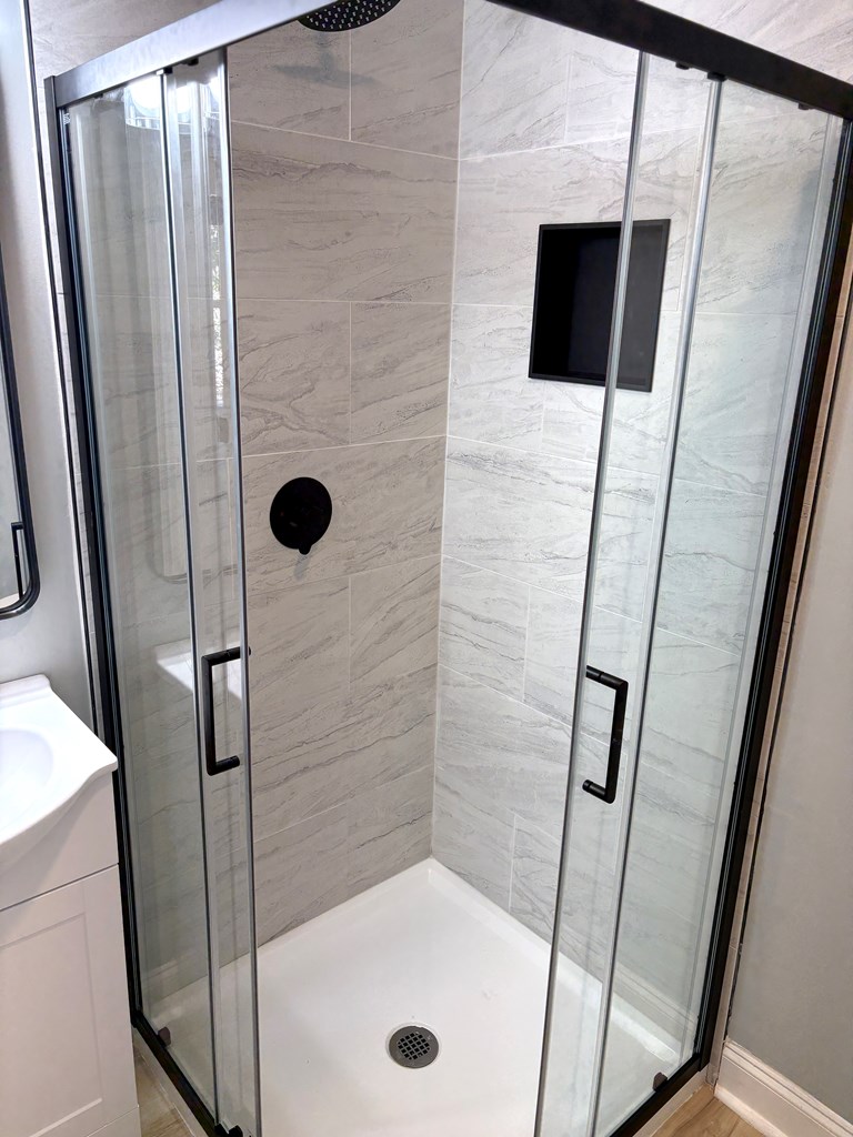 2502 13th Avenue Valley, AL 36854 - Photo 37 of 56 a bathroom with a tub and a shower