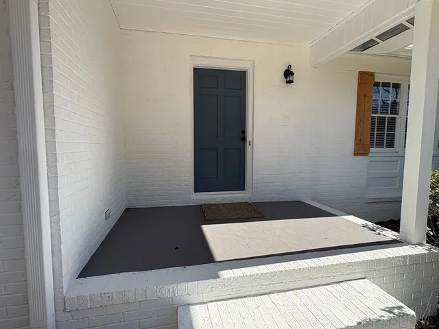 a view of a backyard of the house