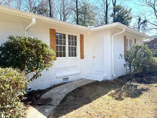 a view of a yard with car parked