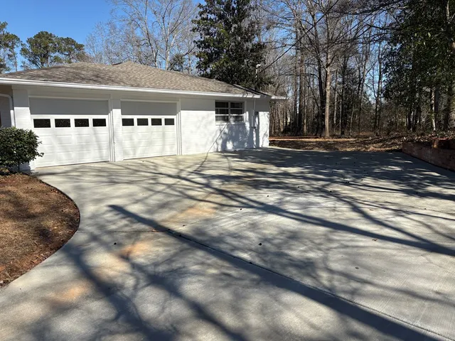 a backyard of a house with lots of green space
