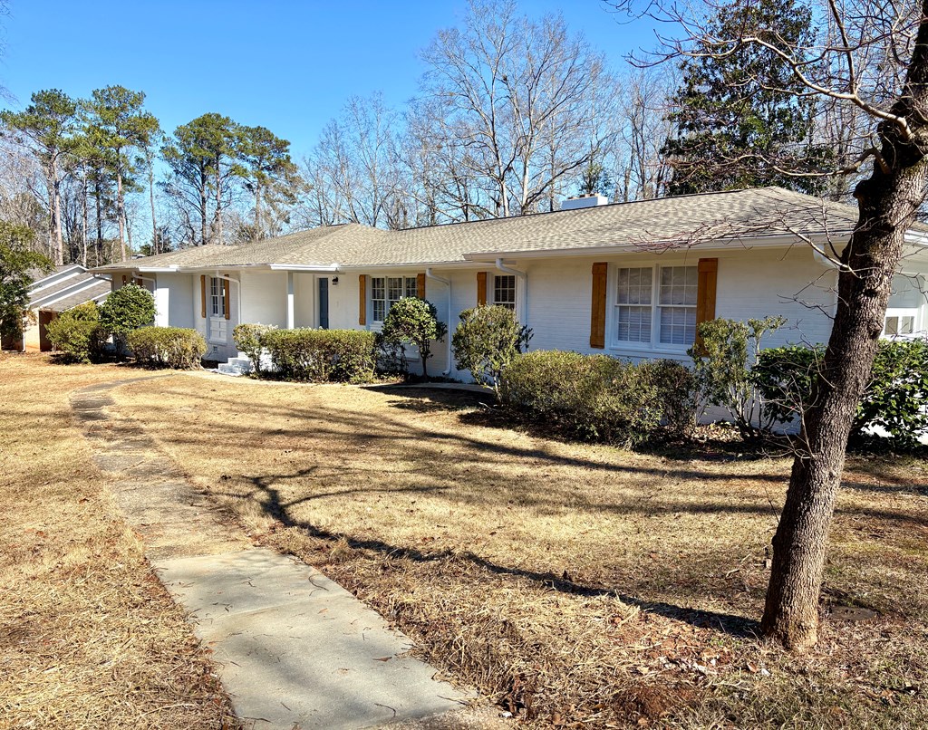 2502 13th Avenue Valley, AL 36854 - Photo 54 of 56 a front view of a house with a yard and potted plants