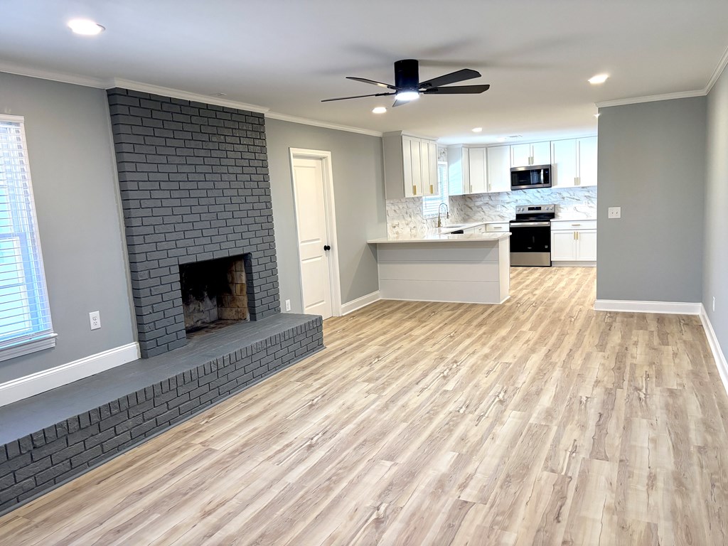 2502 13th Avenue Valley, AL 36854 - Photo 6 of 56 a large white kitchen with granite countertop lots of counter top space and stainless steel appliances