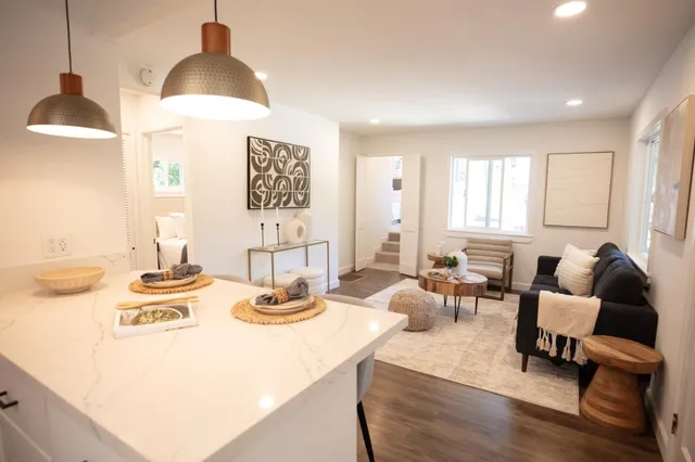 a living room with furniture and a large window