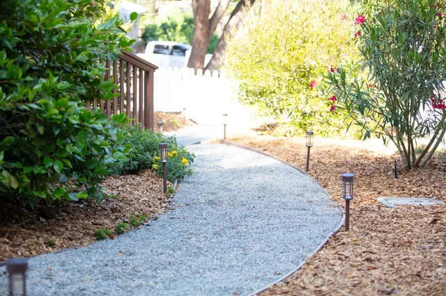 a front view of a house with a yard fire pit and outdoor seating