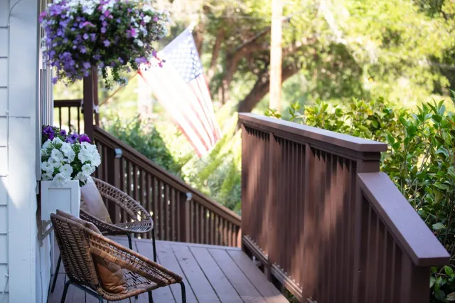 a living room with dining table and chairs