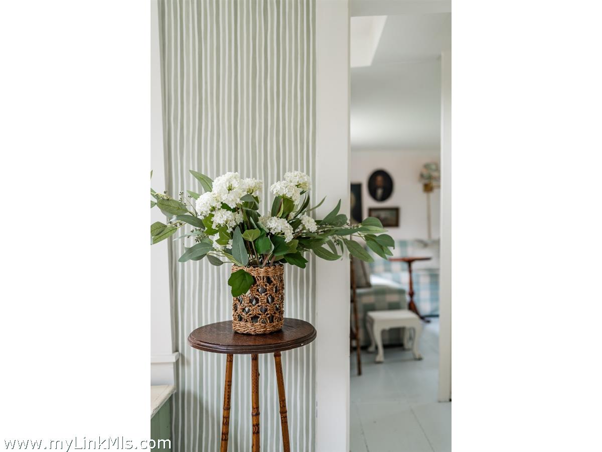 10 Centre Street Nantucket, MA 02554 - Photo 18 of 43 a vase of flowers sitting on a table