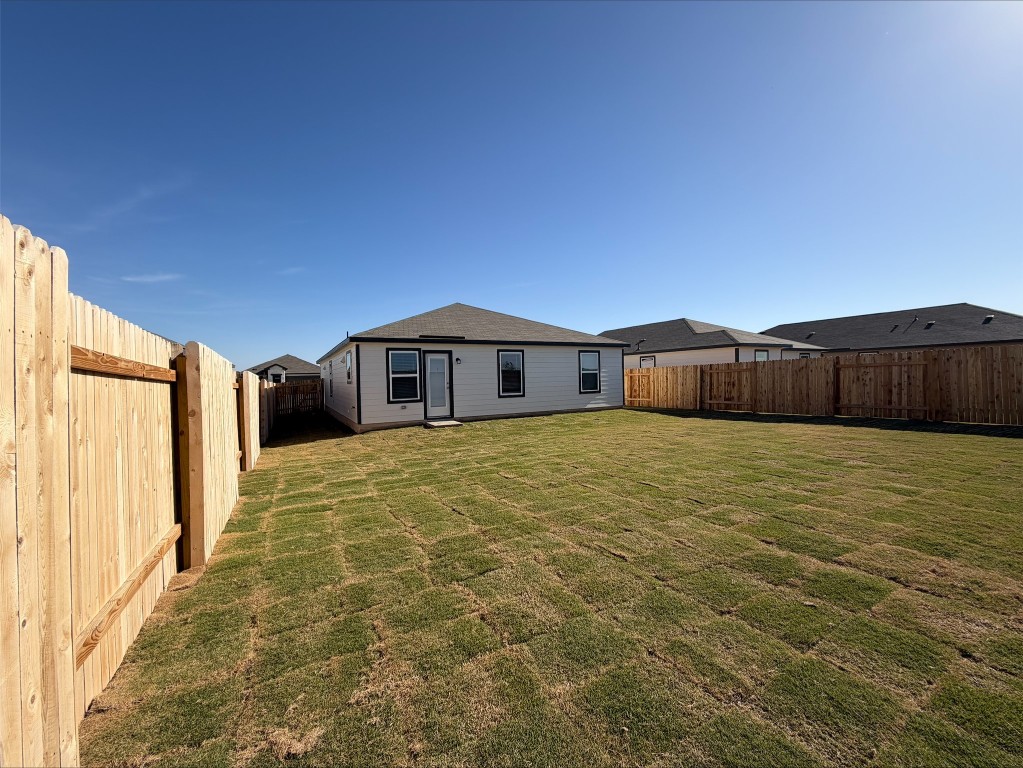 109 Honey Bee Road Jarrell, TX 76537 - Photo 10 of 10 a front view of a house with a yard