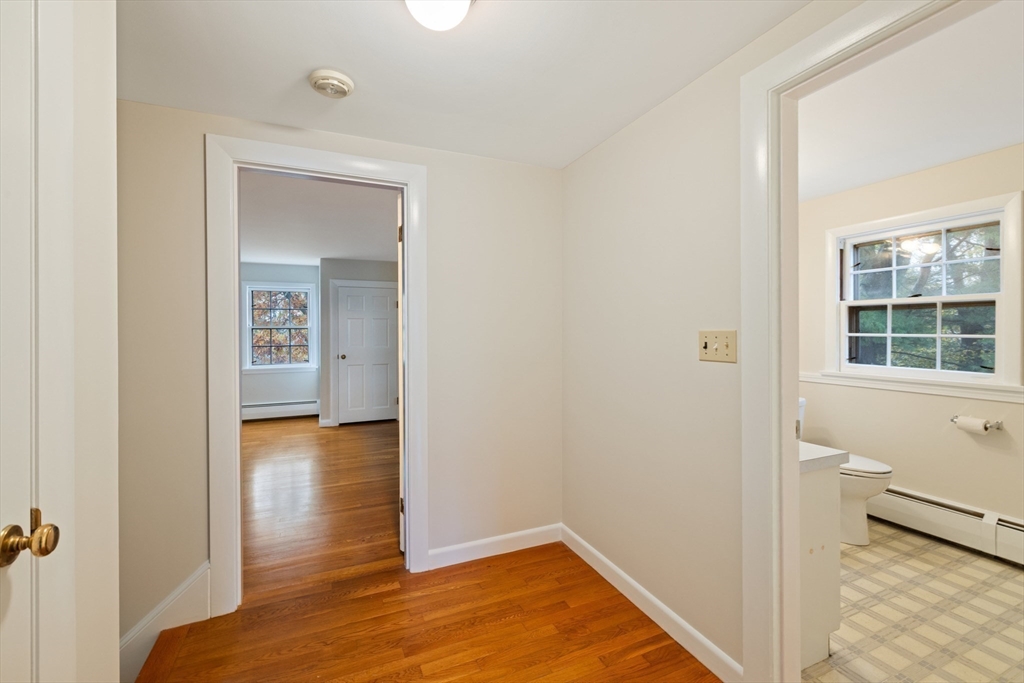 45 Peach Highlands Marblehead, MA 01945 - Photo 15 of 21 a view of a hallway with wooden floor and a room