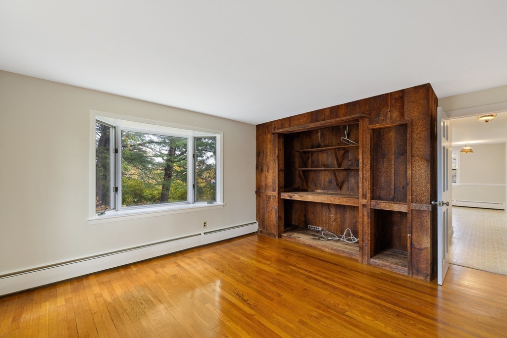 45 Peach Highlands Marblehead, MA 01945 - Photo 10 of 21 a view of an empty room with a window and wooden floor
