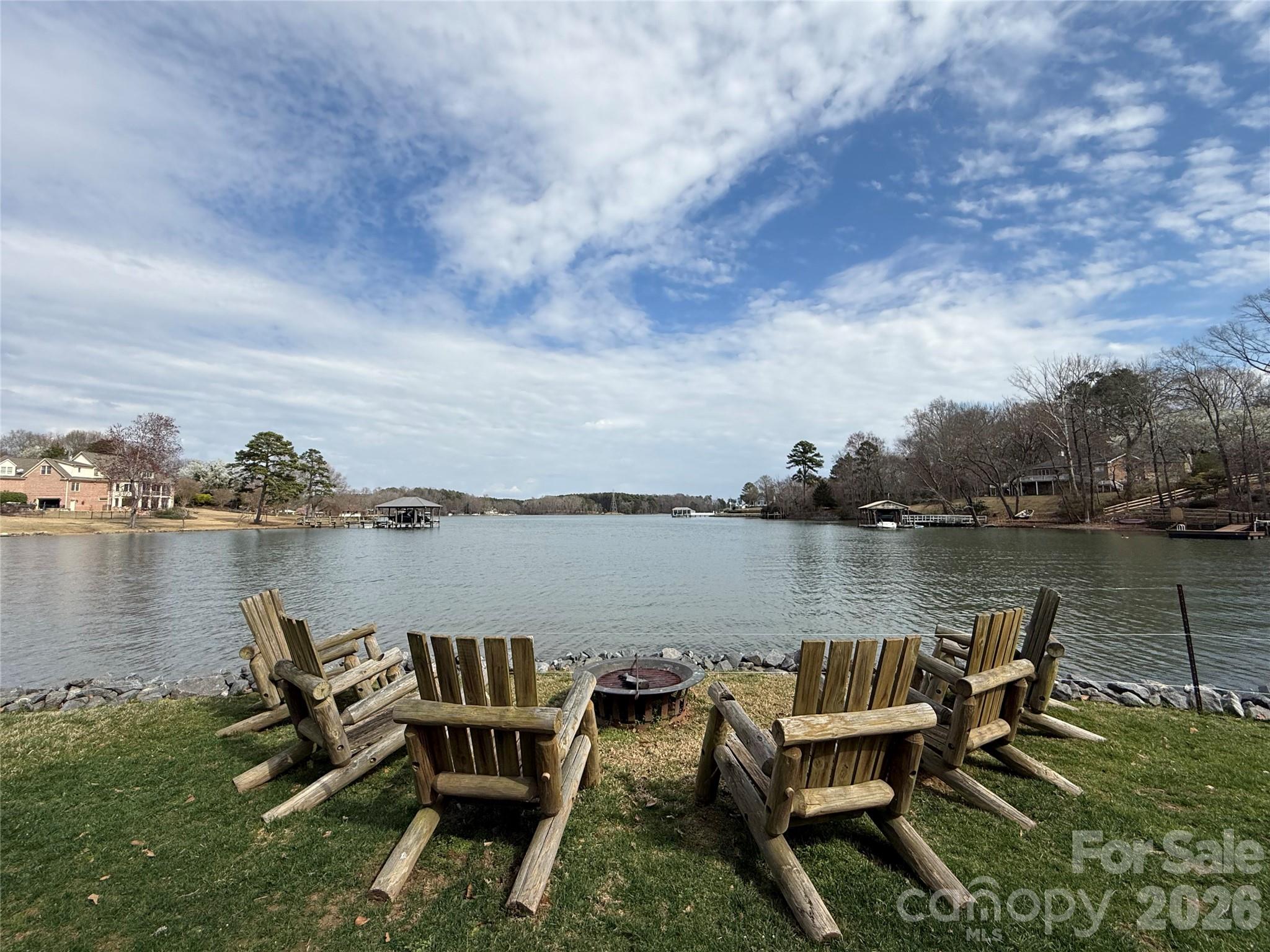 0 Sussex Road York, SC 29745 - Photo 12 of 20 a view of a lake with table and chairs next to a lake