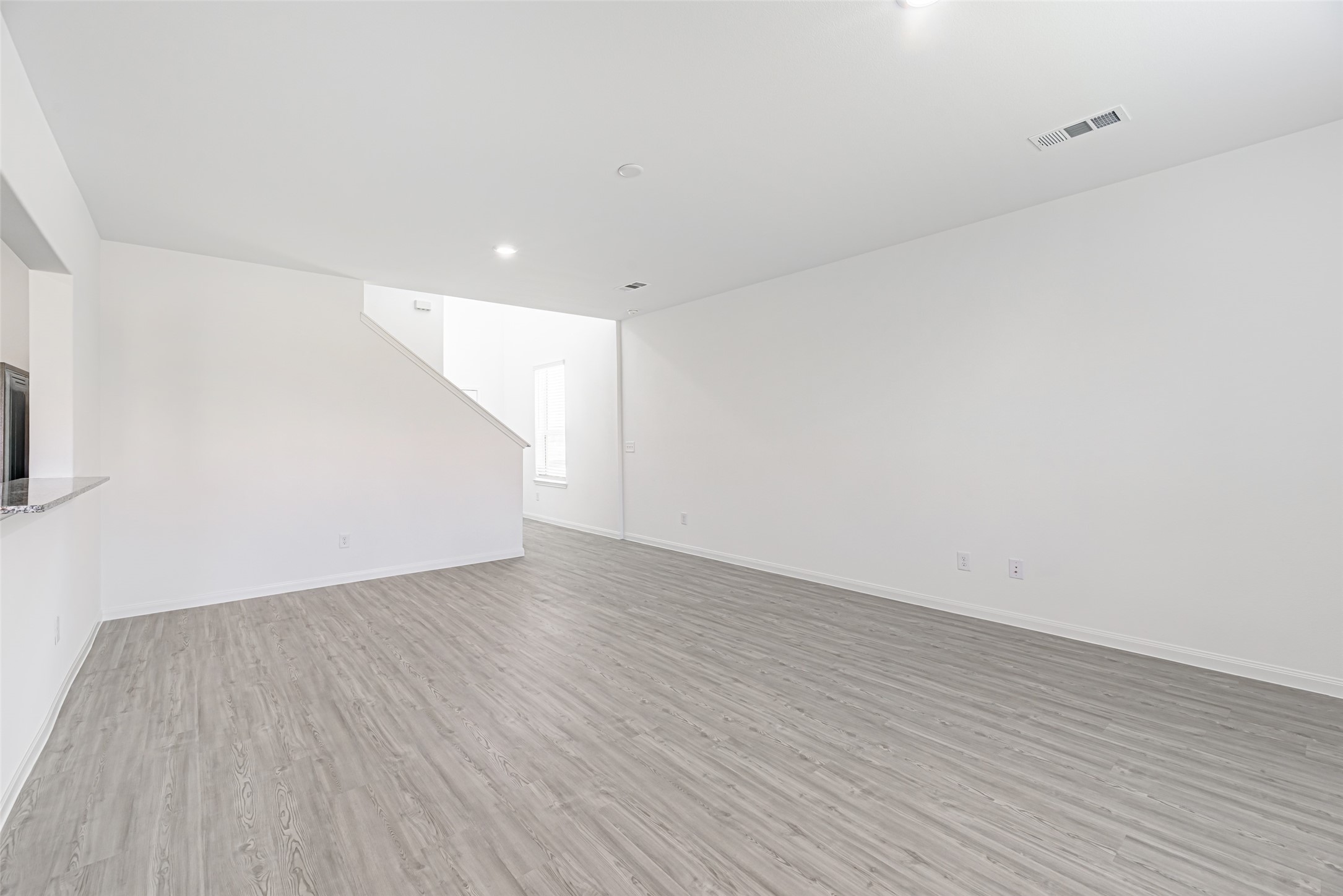 23422 Wagon Cart Road Hockley, TX 77447 - Photo 6 of 28 a view of an empty room with wooden floor