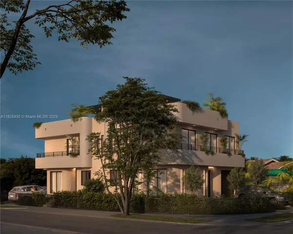 a view of a white building among the street and palm trees