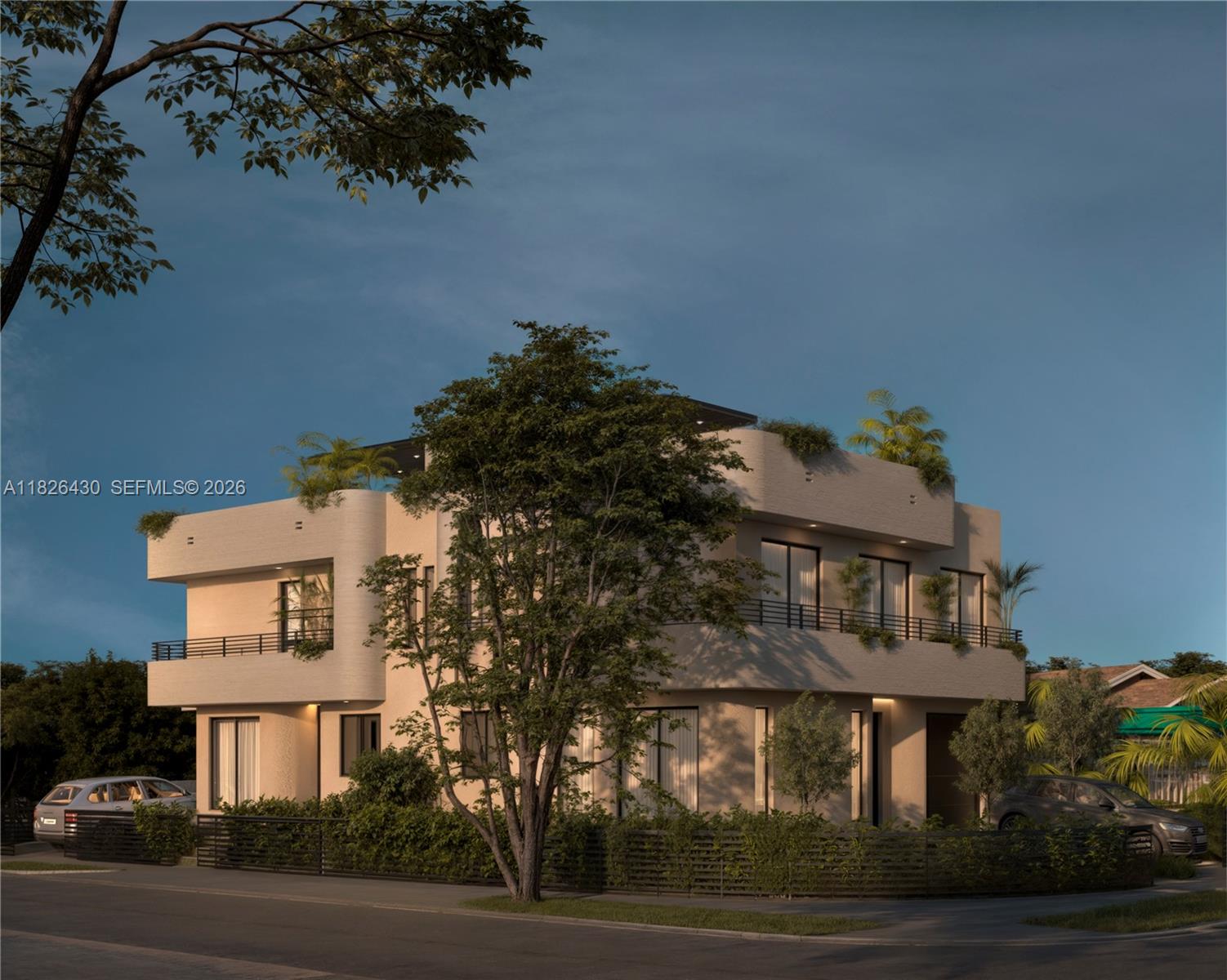 984 Southwest 10th Street, Unit 2 Miami, FL 33130 - Photo 2 of 12 a view of a white building among the street and palm trees