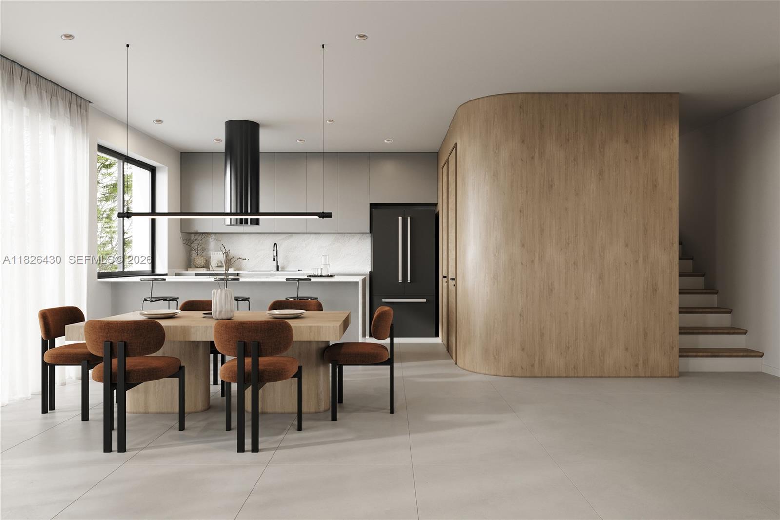 984 Southwest 10th Street, Unit 2 Miami, FL 33130 - Photo 3 of 12 a kitchen with stainless steel appliances refrigerator table and chairs