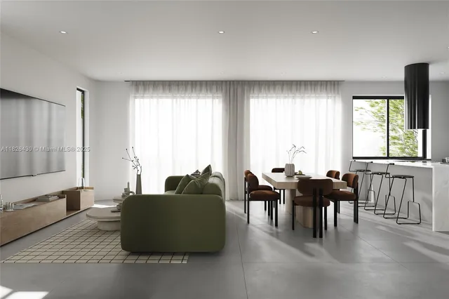 a living room with furniture and large windows