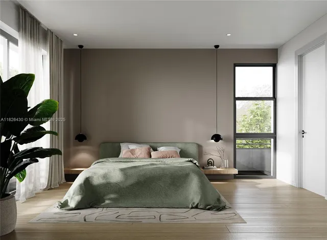 a bedroom with a bed and window