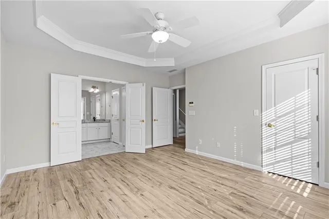a bathroom with a granite countertop sink a mirror and a shower