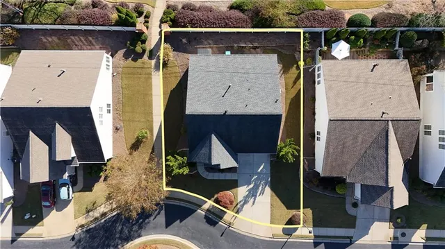 an aerial view of multiple houses with outdoor space