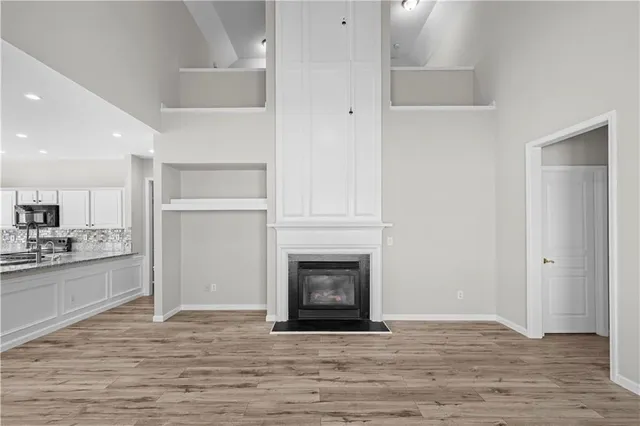 a view of a kitchen and a fireplace