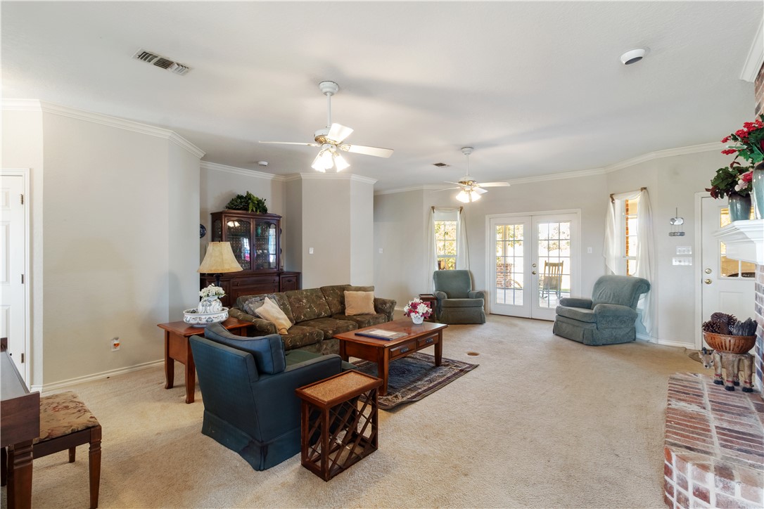 28109 Waller Gladish Road Waller, TX 77484 - Photo 21 of 28 a living room with furniture and a large window